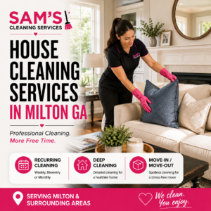 Professional house cleaner arranging pillows in a modern living room during a residential house cleaning service in Milton GA by Sam's Cleaning Services.