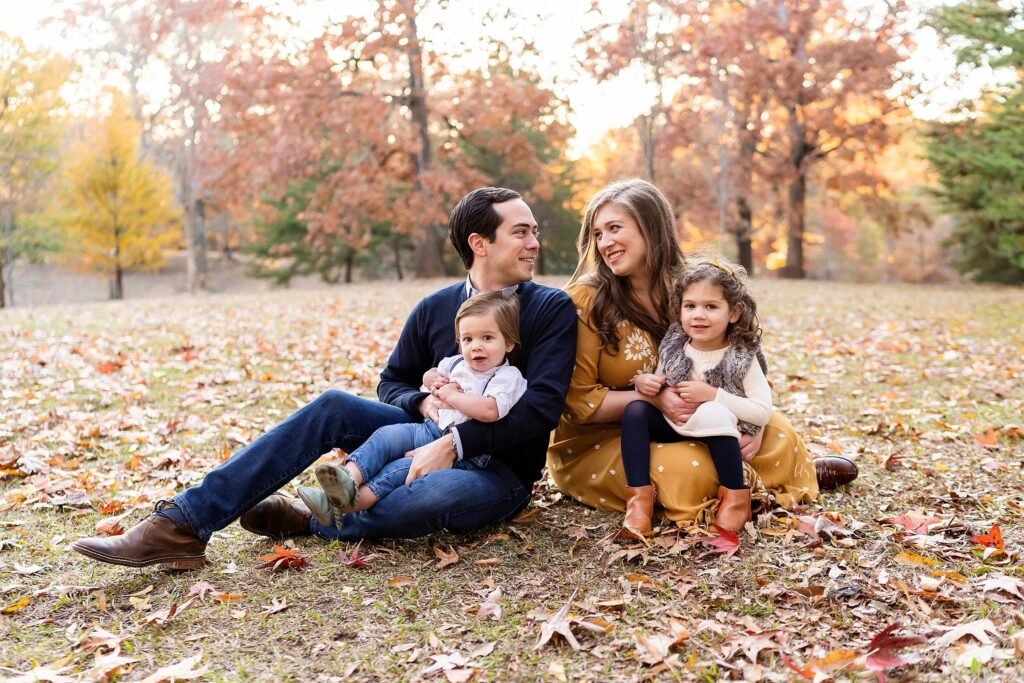 Happy family enjoying quality time together outdoors on a sunny weekend, illustrating the benefits of professional house cleaning in Atlanta GA.