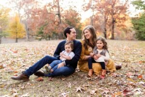 Happy family enjoying quality time together outdoors on a sunny weekend, illustrating the benefits of professional house cleaning in Atlanta GA.